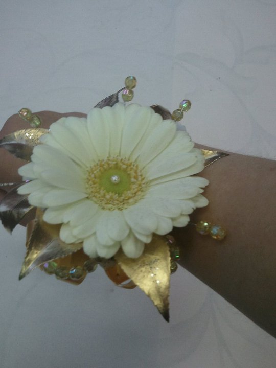 Eileen Jenkins gerbera and gold wristcorsage